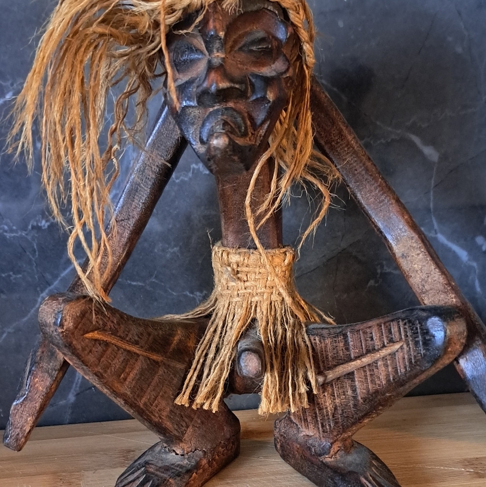 Handcrafted Wooden Sculpture with Natural Fibers